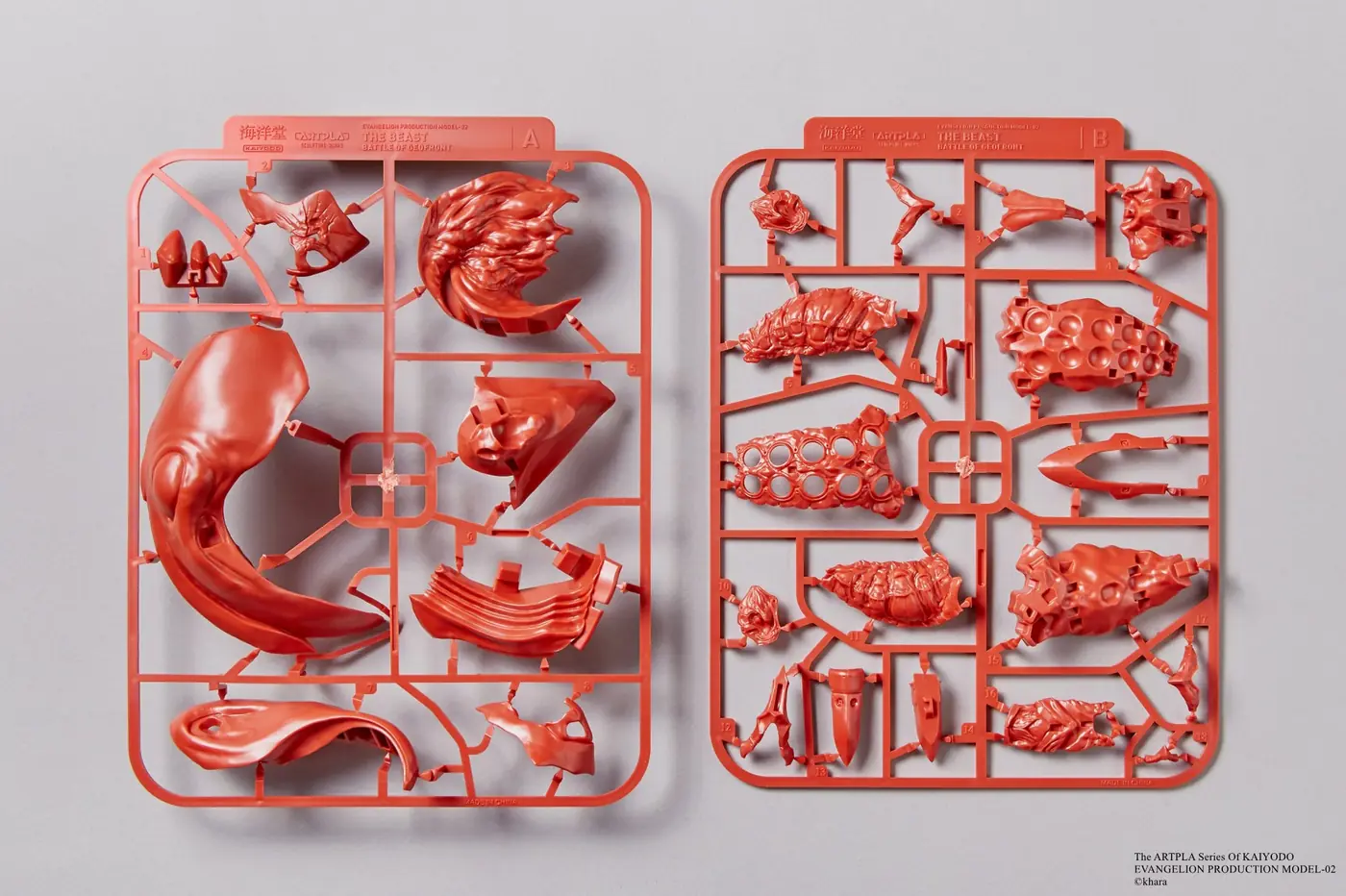 Red plastic runners A and B with large curved and textured model parts