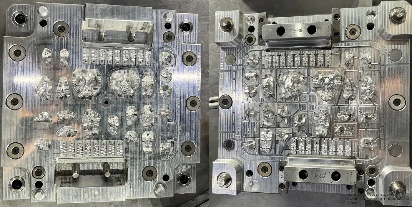 Two metal tooling plates with numerous small cavities and repeated narrow features