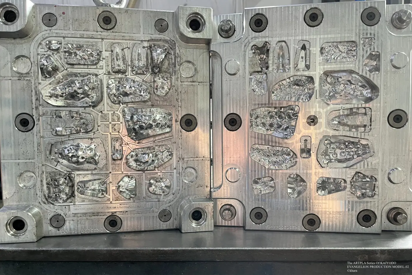 Open metal mold with multiple medium and small sculpted cavities
