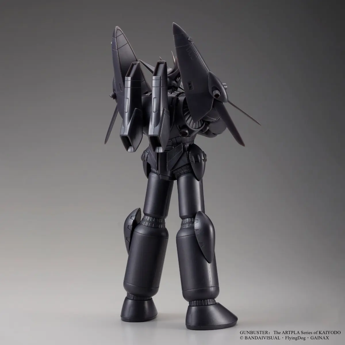 Dark gunmetal Gunbuster model shown from the rear in a three-quarter studio view