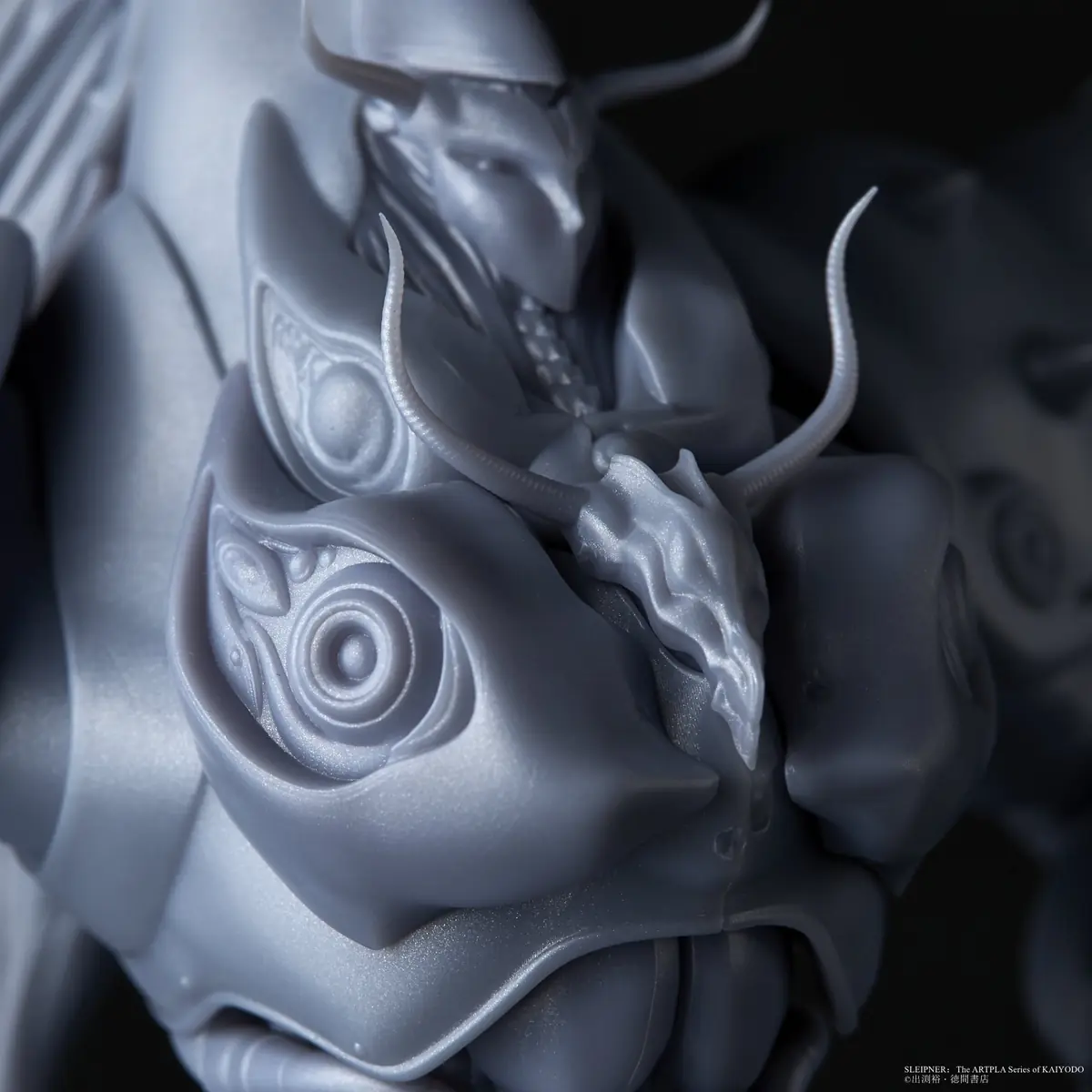 Close-up of ornamental surface detail across the Sleipnir model head and armor