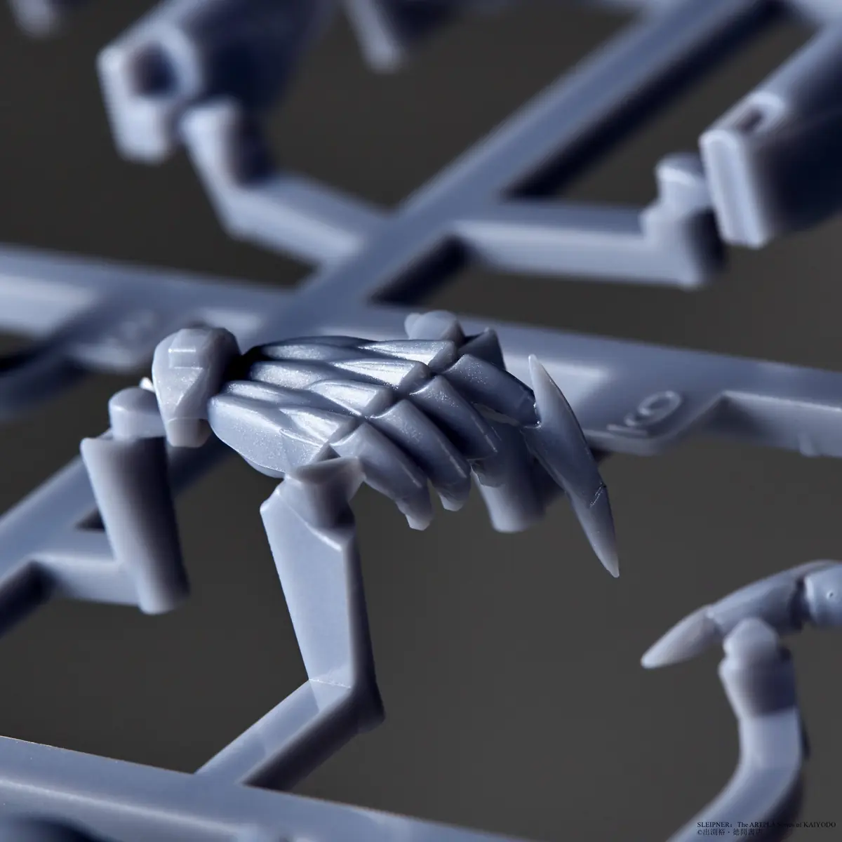 Close-up of a small detailed Sleipnir model component retained on its runner
