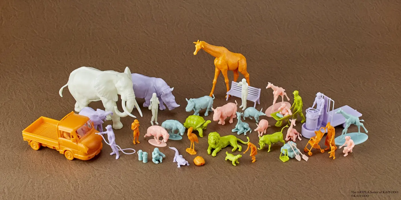 Multicolored zoo animals, people, vehicle and accessories arranged across a textured brown background