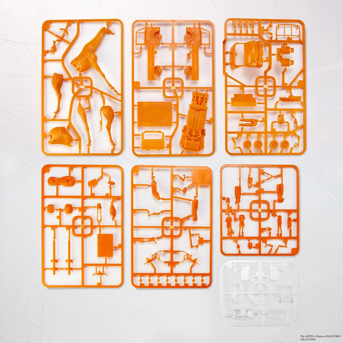 Six orange plastic runners and one clear runner arranged on a white background